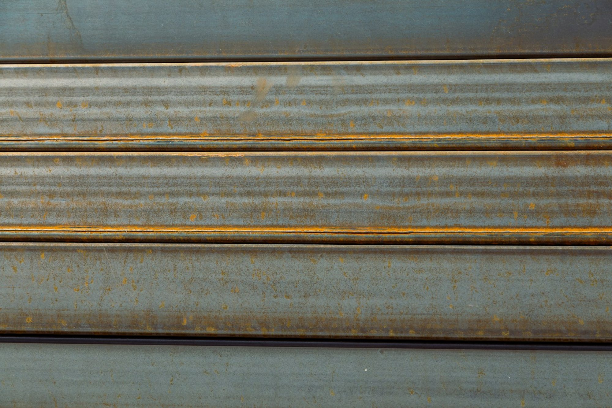a close up of a metal surface with rust
